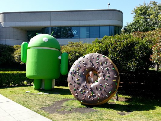 The first day photo — Famous Android "version" statues in front of Android building. Notice the android art in the window made of Post-it notes.